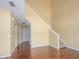 Inviting living room with hardwood floors and staircase at 2246 Stonington Ave # 2246, Orlando, FL 32817