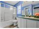 Clean bathroom with a tub, shower, and white vanity at 4420 Hamlet Ct, Kissimmee, FL 34746