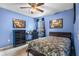 Spacious bedroom with a dresser and ceiling fan at 4420 Hamlet Ct, Kissimmee, FL 34746