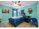 Cheerful bedroom with a twin bed and ceiling fan at 4420 Hamlet Ct, Kissimmee, FL 34746