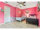 Bright bedroom with tiled floors and a ceiling fan at 4420 Hamlet Ct, Kissimmee, FL 34746