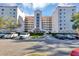 Condo building exterior with parking and landscaping at 1150 Carmel Cir # 201, Casselberry, FL 32707