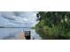 Serene lakefront dock with wooden planks at 1150 Carmel Cir # 201, Casselberry, FL 32707