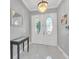 Elegant entryway featuring double doors with oval glass inserts and a marble floor at 8168 Via Bella Notte, Orlando, FL 32836