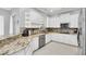 Modern kitchen with granite countertops and stainless steel appliances at 8168 Via Bella Notte, Orlando, FL 32836