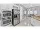 Modern kitchen with stainless steel appliances and granite countertops at 8168 Via Bella Notte, Orlando, FL 32836