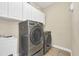 Functional laundry room with washer and dryer included at 8168 Via Bella Notte, Orlando, FL 32836