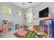 Fun playroom with a play kitchen, toys, and a chalkboard at 8168 Via Bella Notte, Orlando, FL 32836