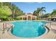 Relaxing community pool with surrounding landscaping at 8168 Via Bella Notte, Orlando, FL 32836