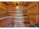 Relax in this private wooden sauna with built-in bench at 8168 Via Bella Notte, Orlando, FL 32836