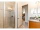 Bathroom featuring a shower and granite vanity at 18920 Overton St, Orlando, FL 32833