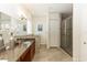 Elegant bathroom with granite countertops, a walk-in shower, and a large mirror at 18920 Overton St, Orlando, FL 32833