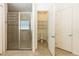 Clean bathroom with walk-in shower, toilet and linen closet at 18920 Overton St, Orlando, FL 32833