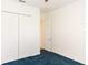 Simple bedroom with double door closet and blue carpet at 18920 Overton St, Orlando, FL 32833