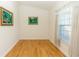 Spacious bedroom with light hardwood floors and window at 18920 Overton St, Orlando, FL 32833