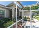 Screened porch entryway with small sitting area at 18920 Overton St, Orlando, FL 32833