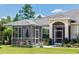 Screened gazebo with a table and chairs at 18920 Overton St, Orlando, FL 32833