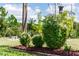 Neatly landscaped yard with manicured shrubs and mulch beds at 18920 Overton St, Orlando, FL 32833