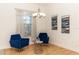 Cozy sitting area with two blue armchairs at 18920 Overton St, Orlando, FL 32833