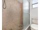 Tile shower with glass door and a toilet at 3186 Mapleshade St, Deltona, FL 32738