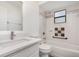 Bright bathroom featuring a shower-tub combo and modern sink vanity at 3186 Mapleshade St, Deltona, FL 32738