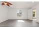 The bedroom has gray floors, white walls and ceilings, and a ceiling fan at 3186 Mapleshade St, Deltona, FL 32738