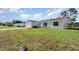 Charming single-story home with a well-maintained lawn and a two-car garage on a sunny day at 3186 Mapleshade St, Deltona, FL 32738
