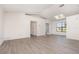 Bright living space boasts new flooring, neutral paint, and seamless transitions to other rooms at 3186 Mapleshade St, Deltona, FL 32738