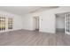 Large living area featuring new flooring, neutral paint, with seamless transitions to other rooms at 3186 Mapleshade St, Deltona, FL 32738