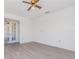 Well-lit living room with a ceiling fan, and French doors that flood the space with natural light at 3186 Mapleshade St, Deltona, FL 32738
