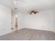 Spacious main bedroom features neutral walls, new floors, and an ensuite bathroom with a shower at 3186 Mapleshade St, Deltona, FL 32738