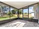Enclosed patio overlooking green backyard at 3186 Mapleshade St, Deltona, FL 32738