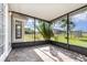 Enclosed patio with views of the backyard at 3186 Mapleshade St, Deltona, FL 32738