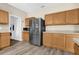 Kitchen with stainless steel appliances and wood cabinets at 525 Aster Dr, Davenport, FL 33897