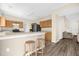 Kitchen features a breakfast bar and wood cabinets at 525 Aster Dr, Davenport, FL 33897