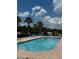 Community pool with lounge chairs at 525 Aster Dr, Davenport, FL 33897