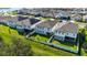 Aerial view of houses with solar panels and backyards at 720 Split Hoof Dr, Saint Cloud, FL 34771