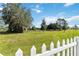 Large backyard with white fence and open space at 720 Split Hoof Dr, Saint Cloud, FL 34771