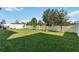 Landscaped backyard with white picket fence at 720 Split Hoof Dr, Saint Cloud, FL 34771