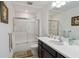 Clean bathroom with a shower/tub combo and dark vanity at 720 Split Hoof Dr, Saint Cloud, FL 34771