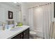 Simple bathroom with a shower/tub combo and white tile at 720 Split Hoof Dr, Saint Cloud, FL 34771