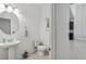 Clean and modern half bathroom with pedestal sink at 720 Split Hoof Dr, Saint Cloud, FL 34771