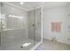 Bathroom with a large glass shower enclosure and updated fixtures at 720 Split Hoof Dr, Saint Cloud, FL 34771