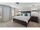 Main bedroom with large bed, nightstands, and ample natural light at 720 Split Hoof Dr, Saint Cloud, FL 34771