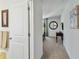 Bedroom hallway with carpet flooring and access to bedroom at 720 Split Hoof Dr, Saint Cloud, FL 34771