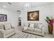 Bright living room features comfy seating and elegant chandelier at 720 Split Hoof Dr, Saint Cloud, FL 34771