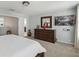 Main bedroom with dresser and large TV at 720 Split Hoof Dr, Saint Cloud, FL 34771