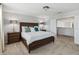 Main bedroom with king-size bed and access to a balcony at 720 Split Hoof Dr, Saint Cloud, FL 34771