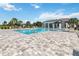 Community pool with lounge chairs and clubhouse at 720 Split Hoof Dr, Saint Cloud, FL 34771