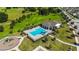 Community pool with lounge chairs and playground at 720 Split Hoof Dr, Saint Cloud, FL 34771